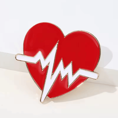 Broche con forma de corazón y forma de pluma