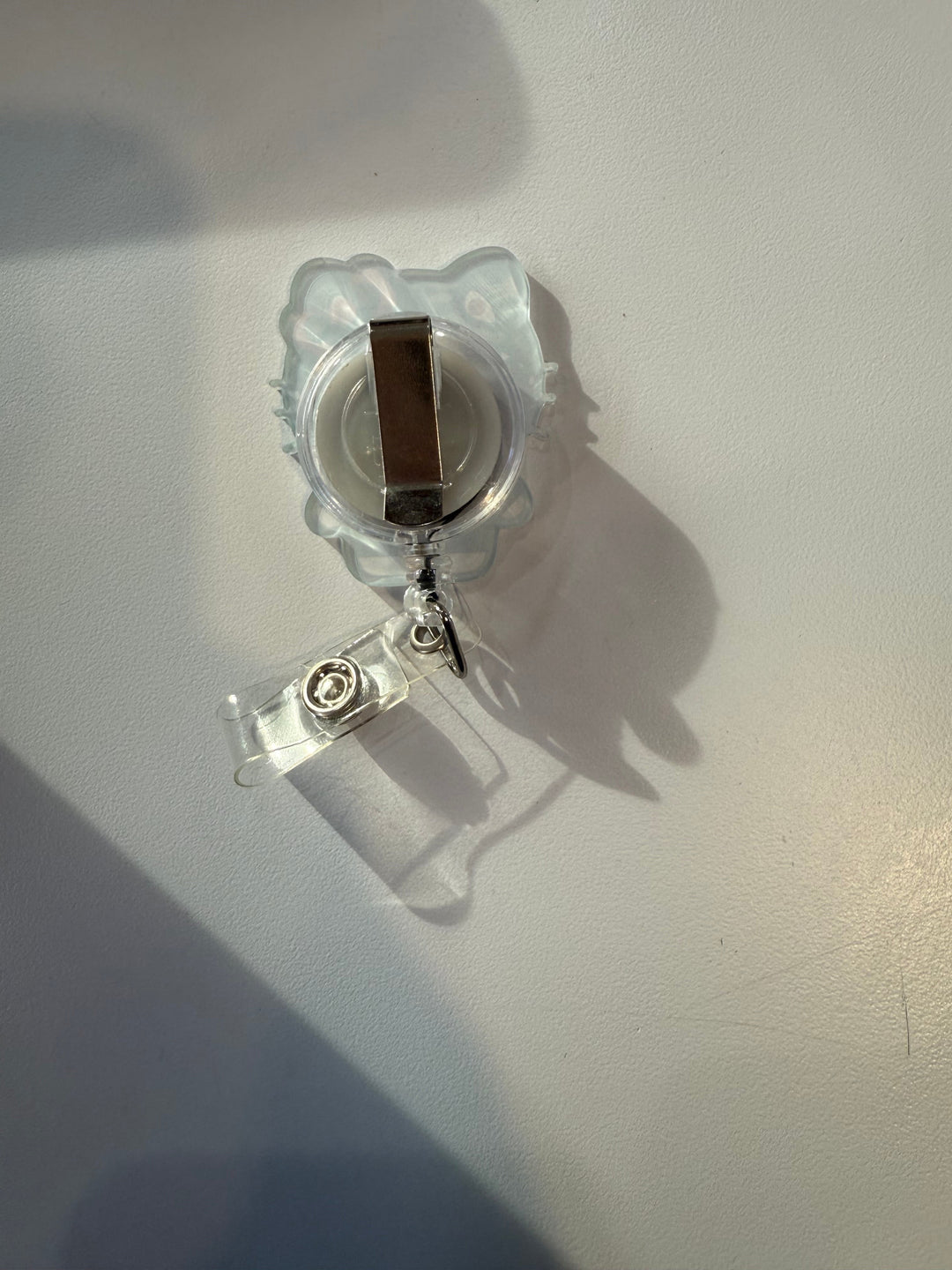 Scrubs Galore Uniforms white Hello Kitty inspired retractable badge reel with alligator clip and ID holder.