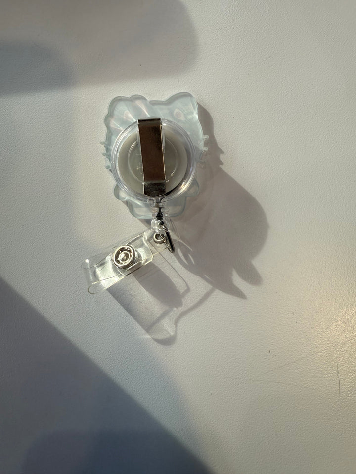 Scrubs Galore Uniforms white Hello Kitty inspired retractable badge reel with alligator clip and ID holder.