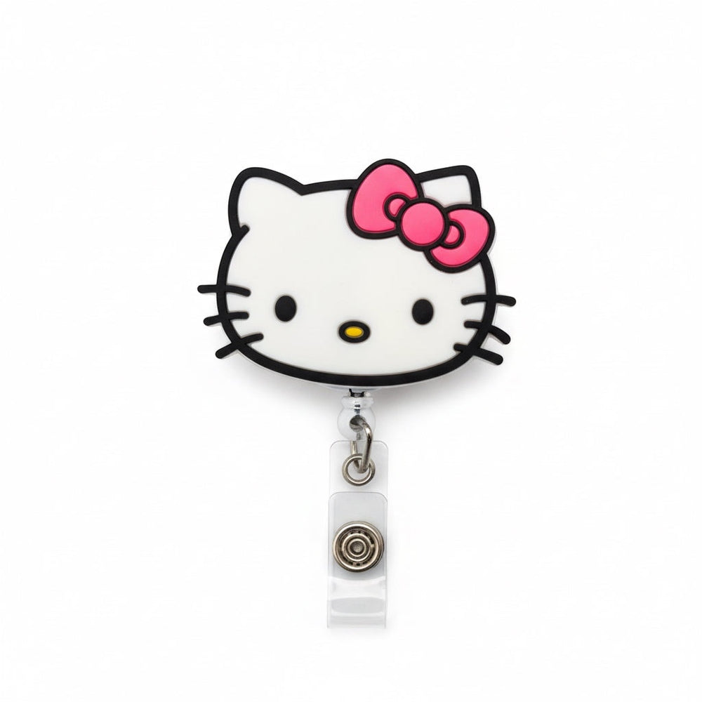 Scrubs Galore Uniforms white Hello Kitty inspired retractable badge reel with pink bow and alligator clip.