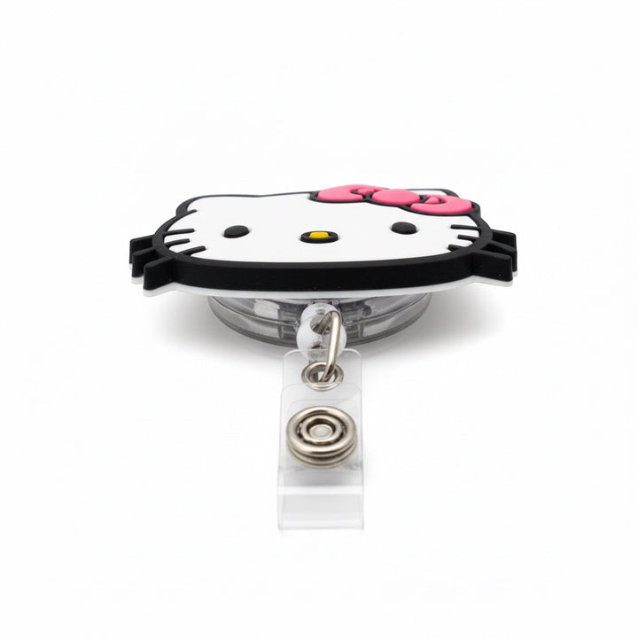 Scrubs Galore Uniforms white Hello Kitty inspired retractable badge reel with pink bow and alligator clip.
