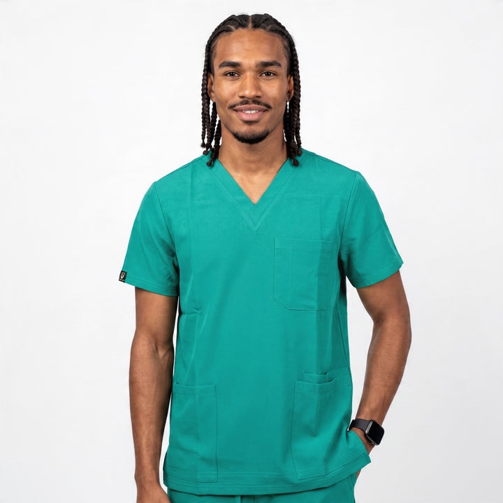 Man wearing a Scrubs Galore Uniforms hunter green Glide Flex V-neck scrub top with three pockets