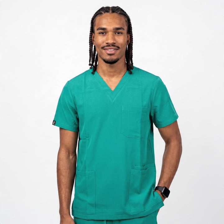Scrubs Galore Uniforms Glide Flex hunter green V-neck scrub top with three pockets worn by a male model